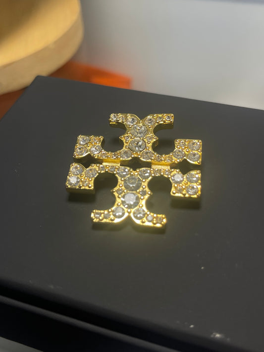 Broche Tory Burch