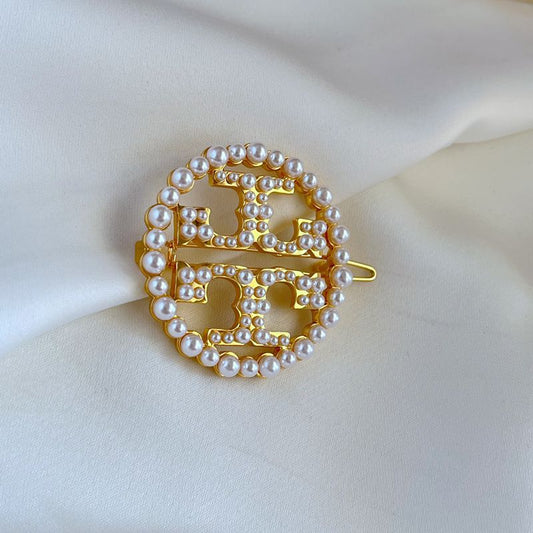 Broche Tory Burch
